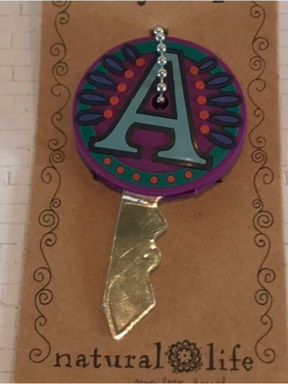 ISO!!!! NATURAL LIFE Purple Key Cover with Teal Letter A and Orange Accents
